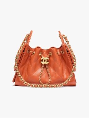 CHANEL Orange Quilted Drawstring Shoulder Bag with Gold Chain